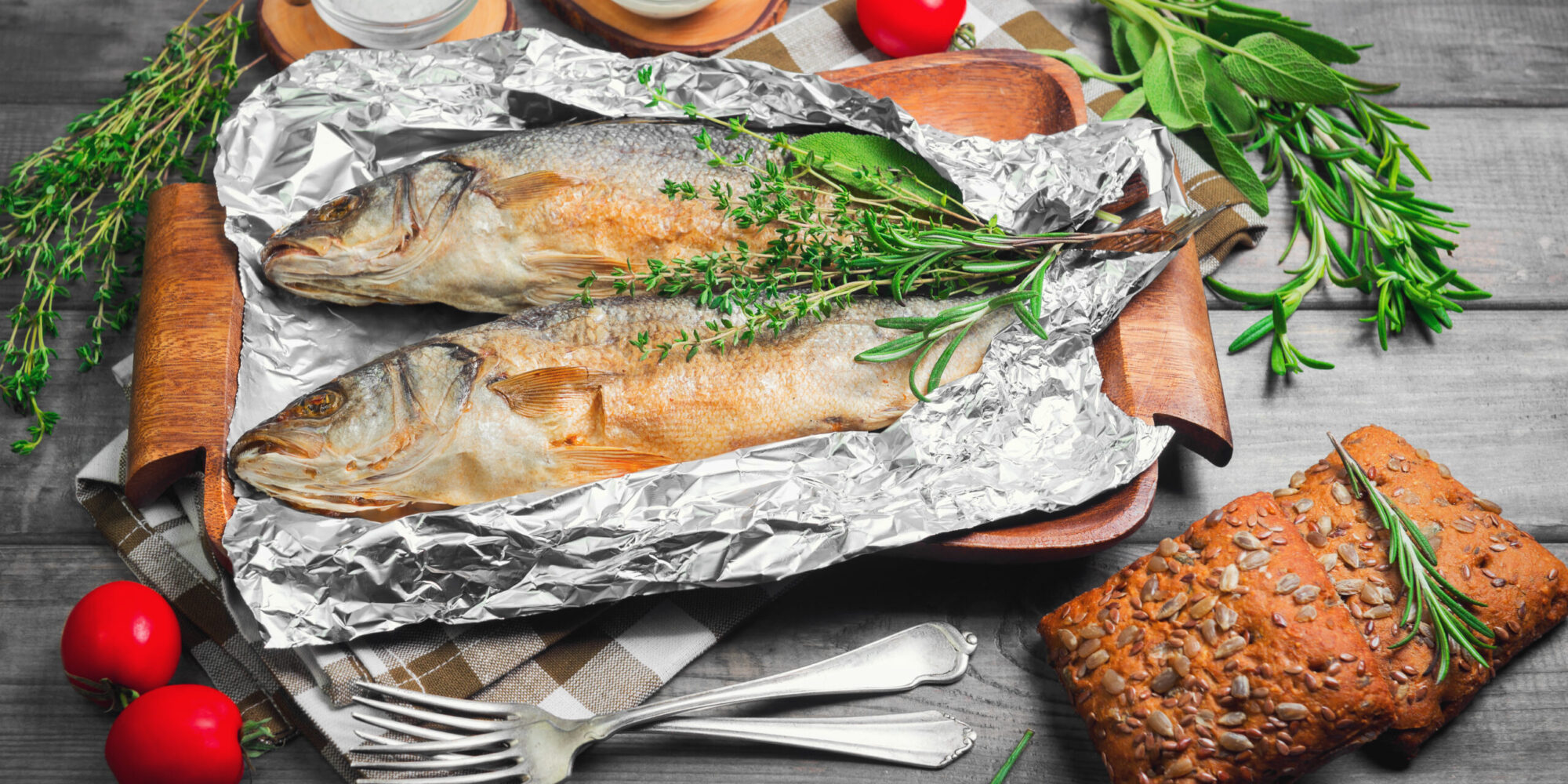 Two,Grilled,Whole,Fish,Trout,On,An,Aluminum,Foil,On